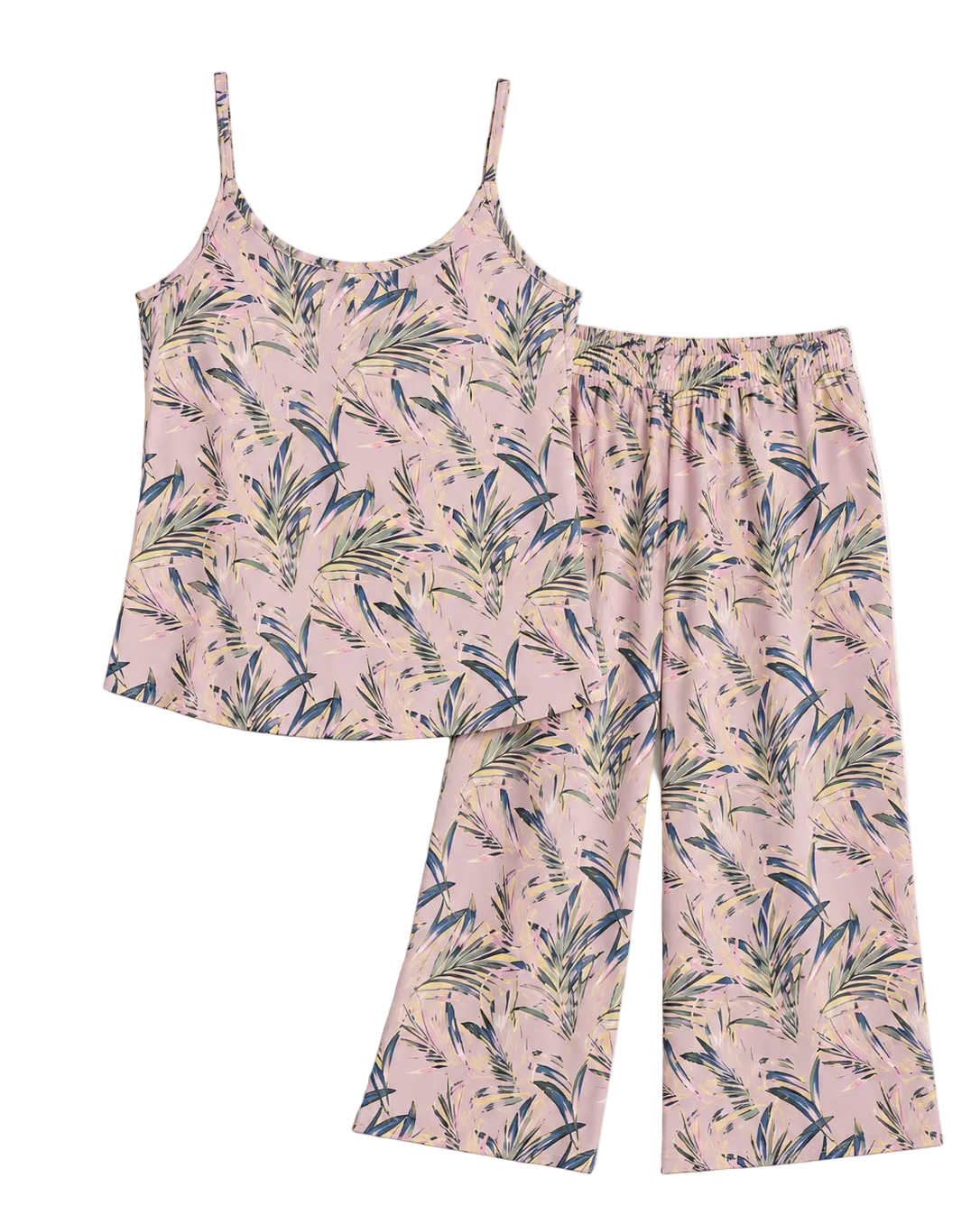 A two-piece pajama set featuring a light pink camisole top and matching cropped pants with a tropical palm leaf print in navy blue and olive green, laid flat against a light beige background.