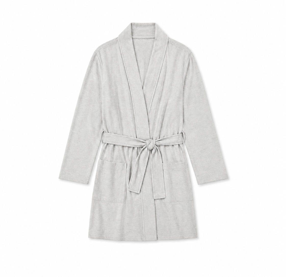 A light gray heathered cotton bathrobe with a shawl collar, long sleeves, front pockets, and a matching tie belt, shown flat on a white background.