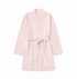 A light pink cotton bathrobe with a tie belt and front patch pockets, displayed flat against a solid white background.