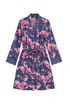 A 3/4 sleeve floral robe with a tie waist and lace trim at the cuffs, featuring a blue base with pink and purple peony patterns, laid flat on a beige background.