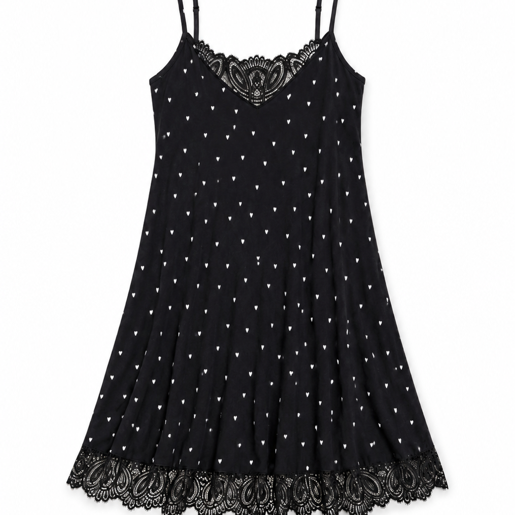 A black spaghetti-strap mini dress with a white polka-dot pattern and black lace trim at the neckline and hem, displayed flat against a white background.