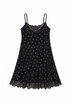 A black spaghetti-strap mini dress with a white polka-dot pattern and black lace trim at the neckline and hem, displayed flat against a white background.
