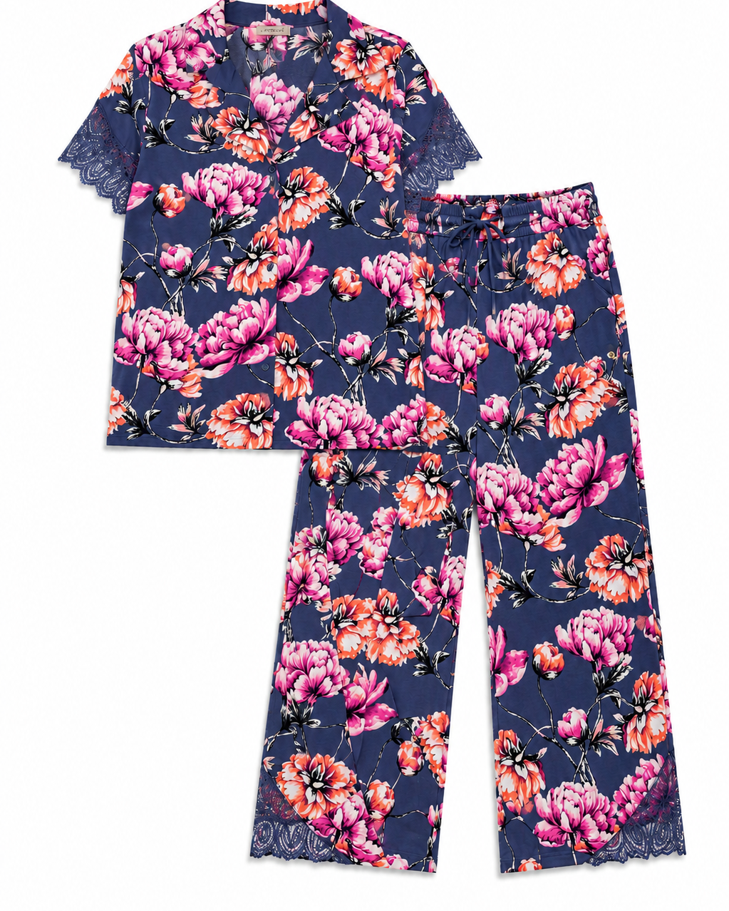 A two-piece pajama set featuring a short-sleeve top and matching pants in a navy blue base with a vibrant pink, orange, and white floral print, finished with lace trim on the sleeves and hems.
