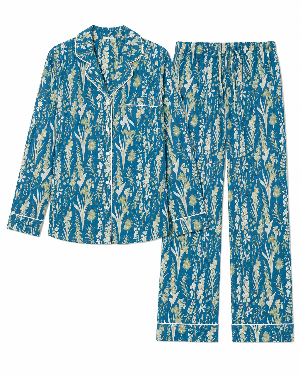 A two-piece pajama set featuring a long-sleeve button-up shirt and matching pants, both decorated with a dense botanical and floral pattern in teal blue, cream, and light green, finished with white piping details.