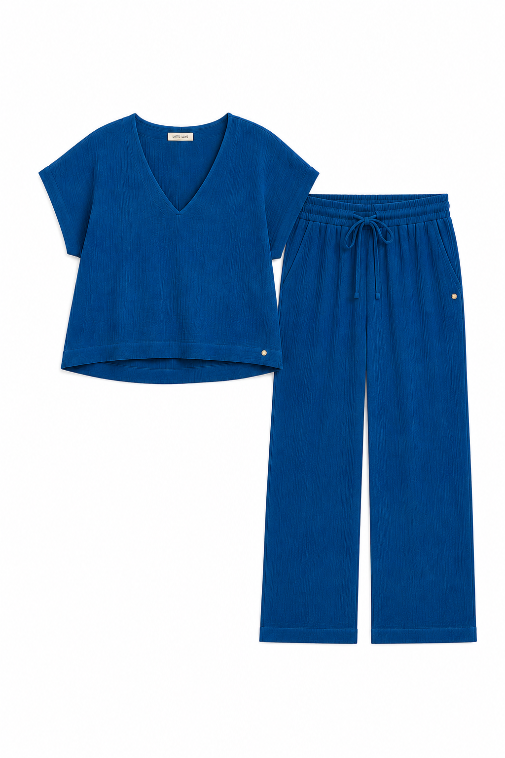 A two-piece loungewear set in a rich royal blue color, featuring a short-sleeve V-neck cropped top and matching drawstring pants, laid flat on a white background.